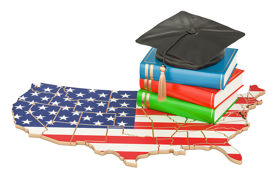 Map of the United States with graduation cap and textbooks resting on it