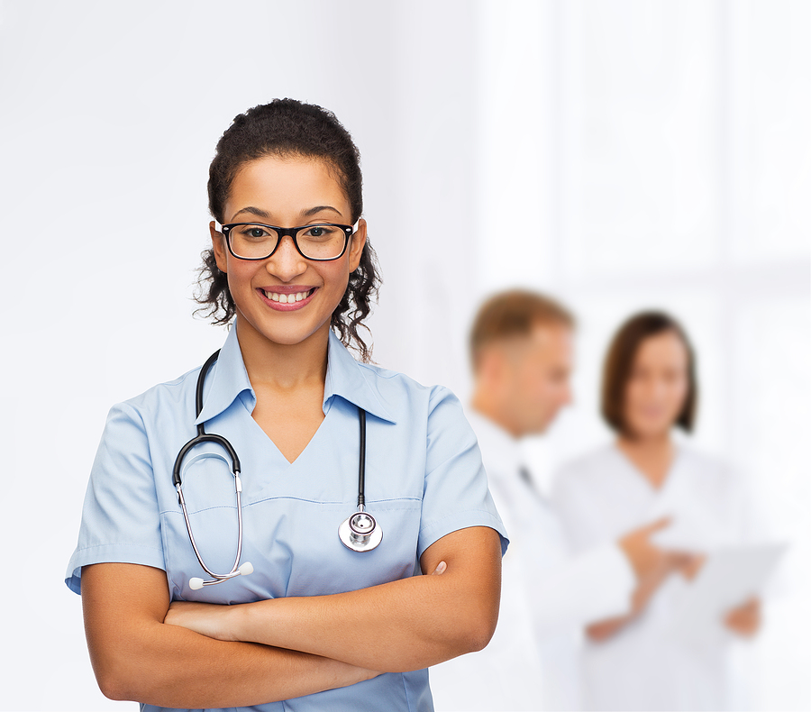 Nurse Educator standing in front of several registered nurses.