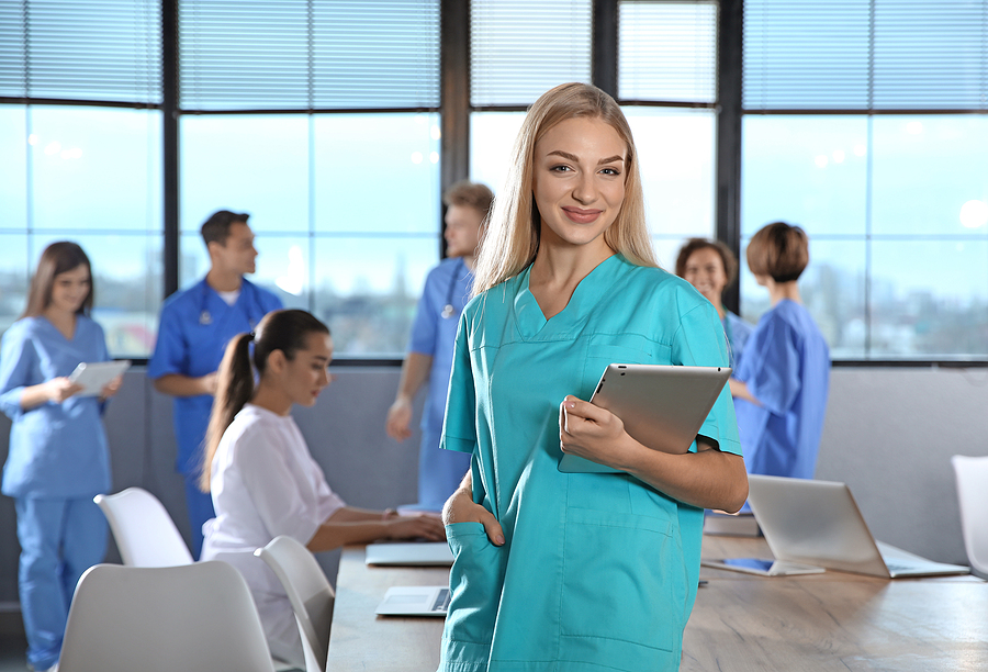 Nurse who has transitioned into a nurse educator in a classroom with nursing students